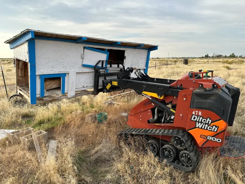 Top Shelf crew removing an old chicken coop structure in a Boise Idaho backyard