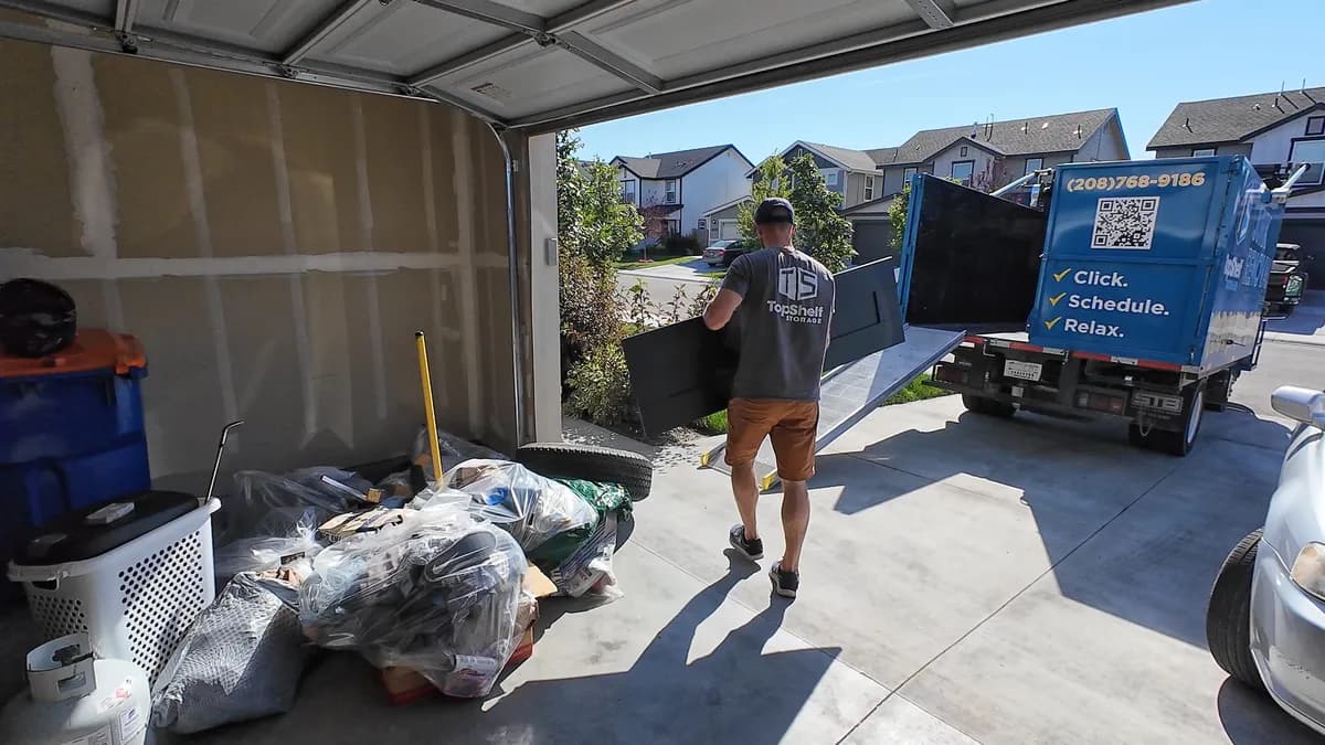 Top Shelf crew loading leftover garage sale junk into the truck in Nampa Idaho