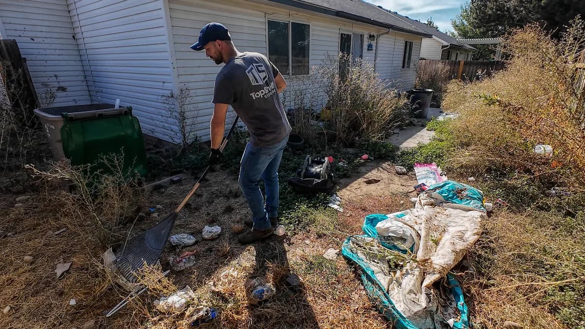 Top Shelf crew raking during a yard cleanout