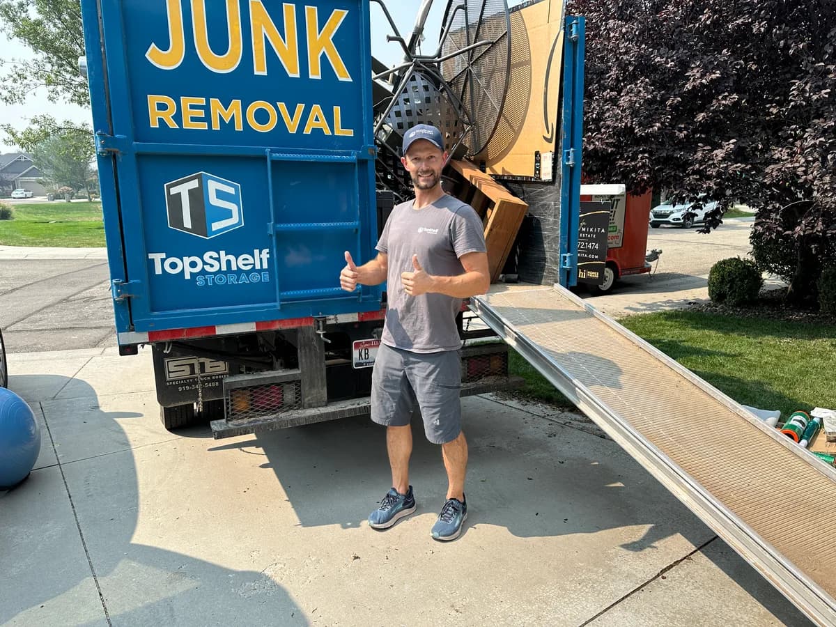 Top Shelf crew member giving a thumbs up after loading patio furniture onto the truck in Meridian Idaho