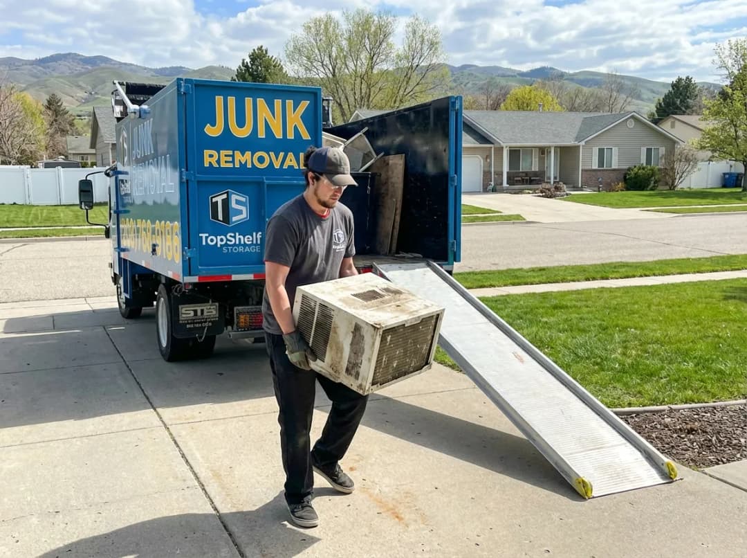 Top Shelf crew removing a freon-containing appliance from a residential property in Eagle Idaho