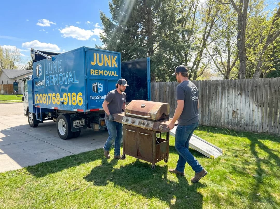 Top Shelf crew removing a BBQ grill from a residential property in Meridian Idaho