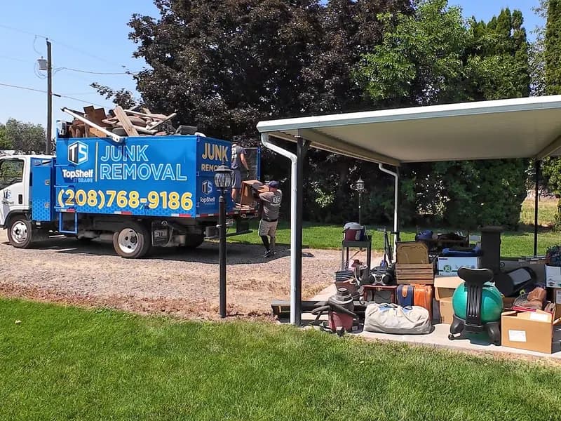 Top Shelf cleanout crew loading household items from a property cleanout in Boise Idaho