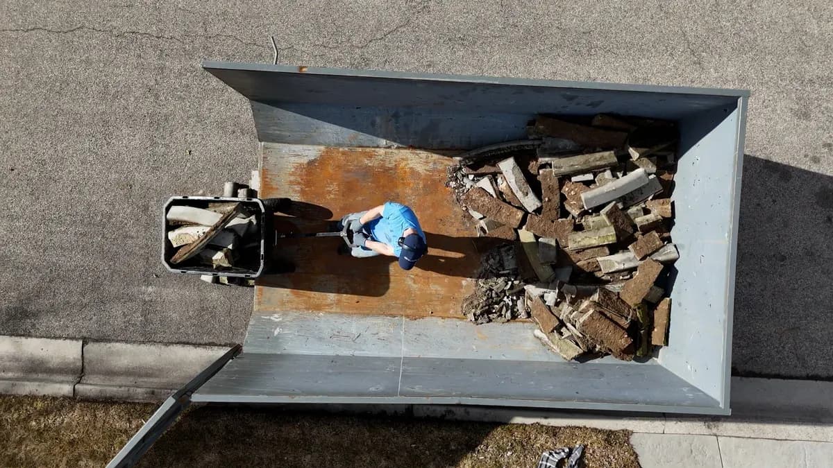 Concrete curbing pieces being loaded onto the Top Shelf truck