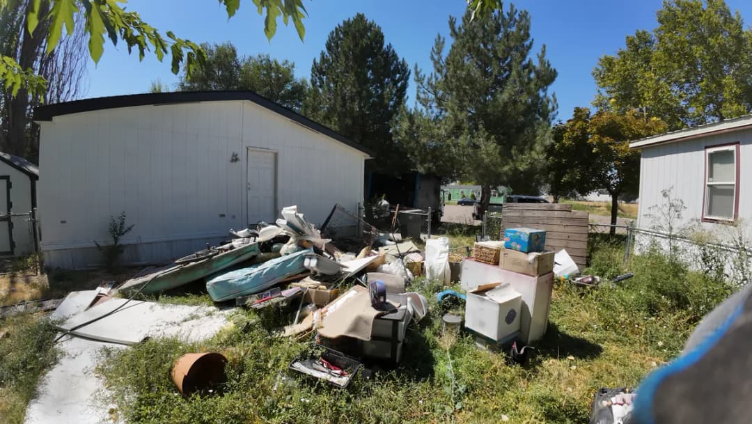 Yard debris during a property cleanout by Top Shelf