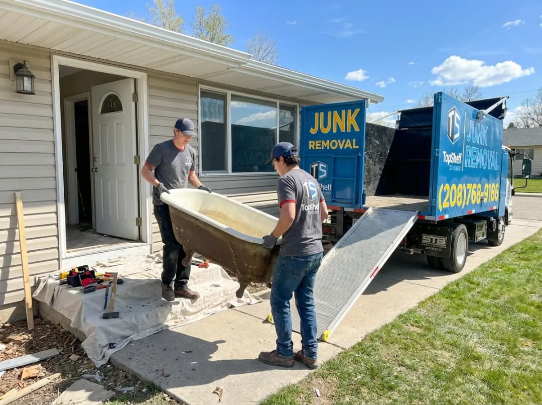 Top Shelf crew removing a bathtub from a residential property in Nampa Idaho