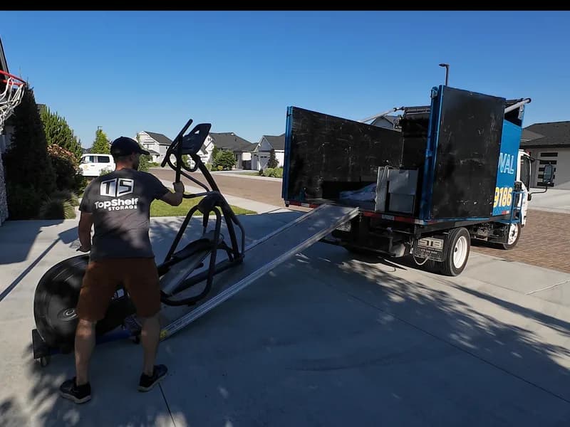 Top Shelf crew removing an elliptical machine in Meridian Idaho