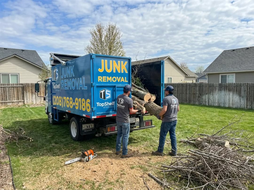 Top Shelf crew removing tree debris from a residential property in Star Idaho